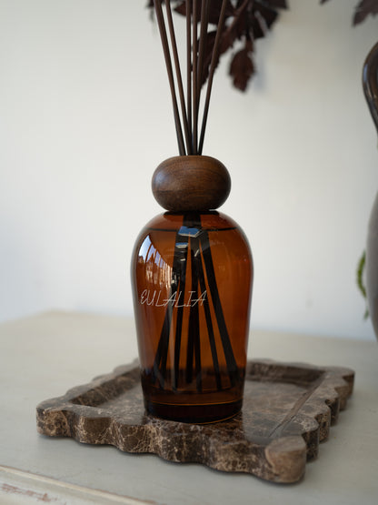 Eulalia Amber Reed Diffuser on scalloped brown marble tray