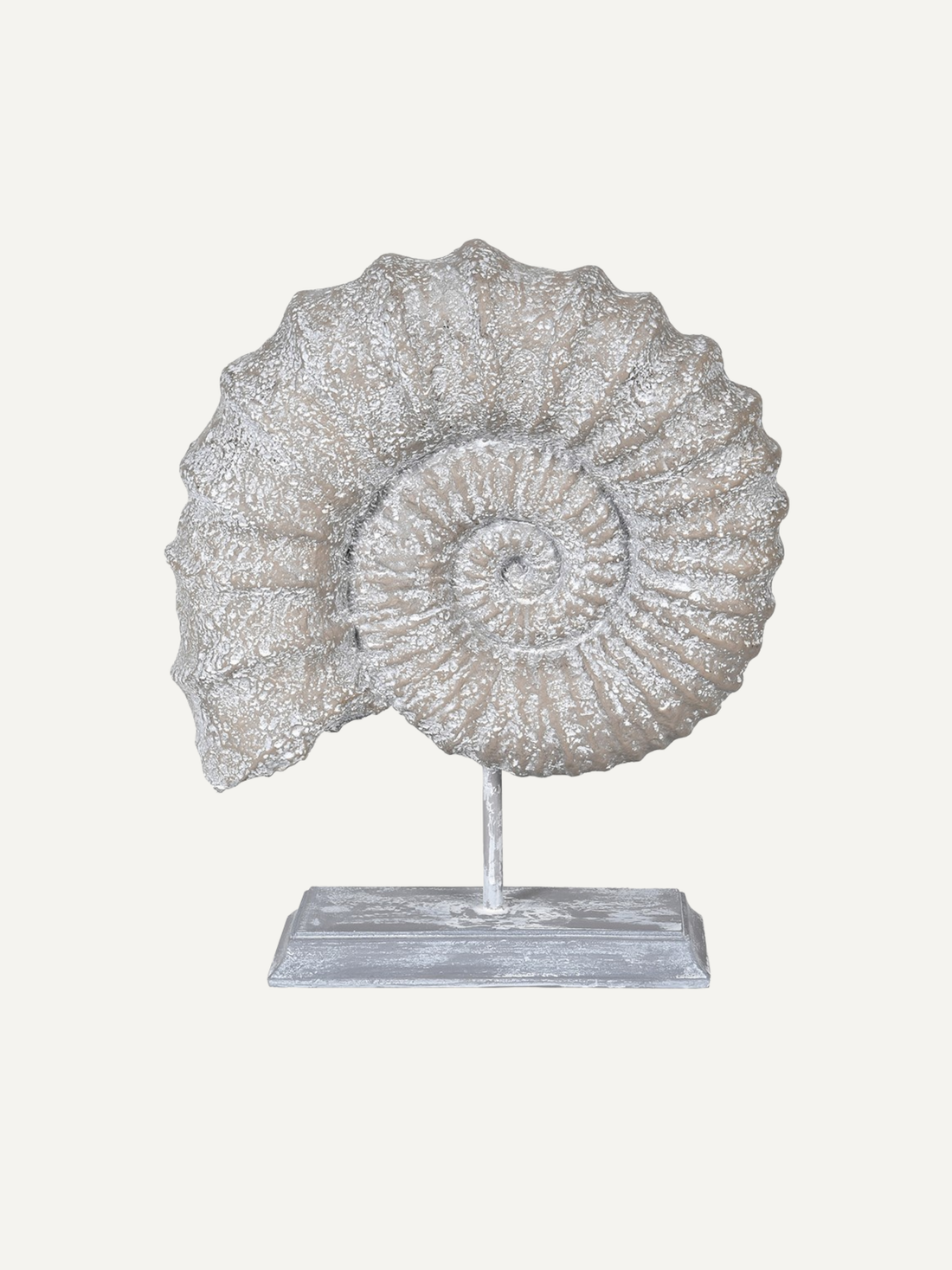 Decorative shell sculpture on a stand with a white background for bathroom styling and home decor
