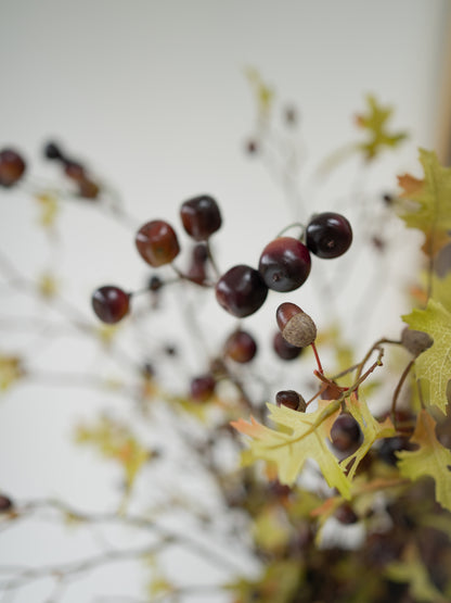 faux autumn oak leaves and cherries floral arrangement