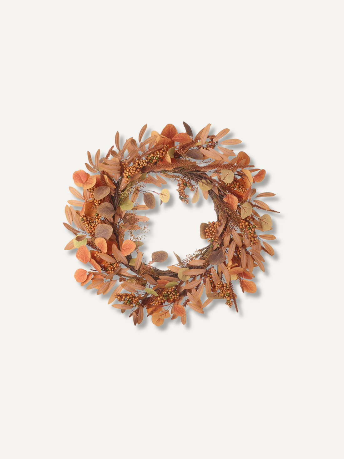 An autumn-themed decorative wreath made of dried orange, brown, and beige leaves, acorns, and small berry clusters, centered on a light off-white background.