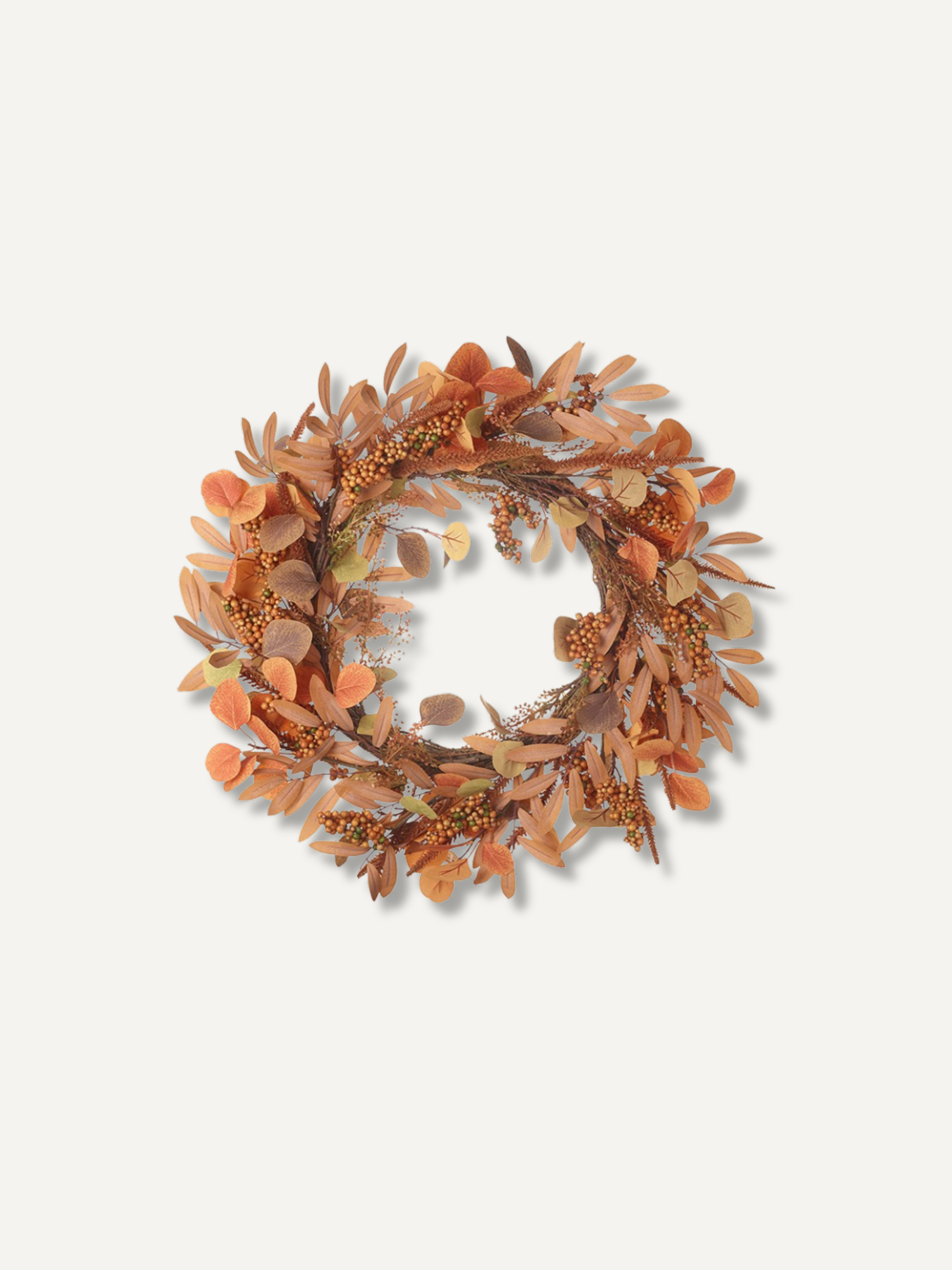 An autumn-themed decorative wreath made of dried orange, brown, and beige leaves, acorns, and small berry clusters, centered on a light off-white background.