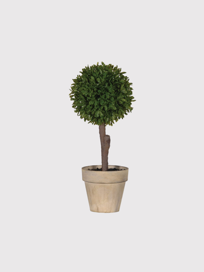 faux potted topiary plant on a light gray background