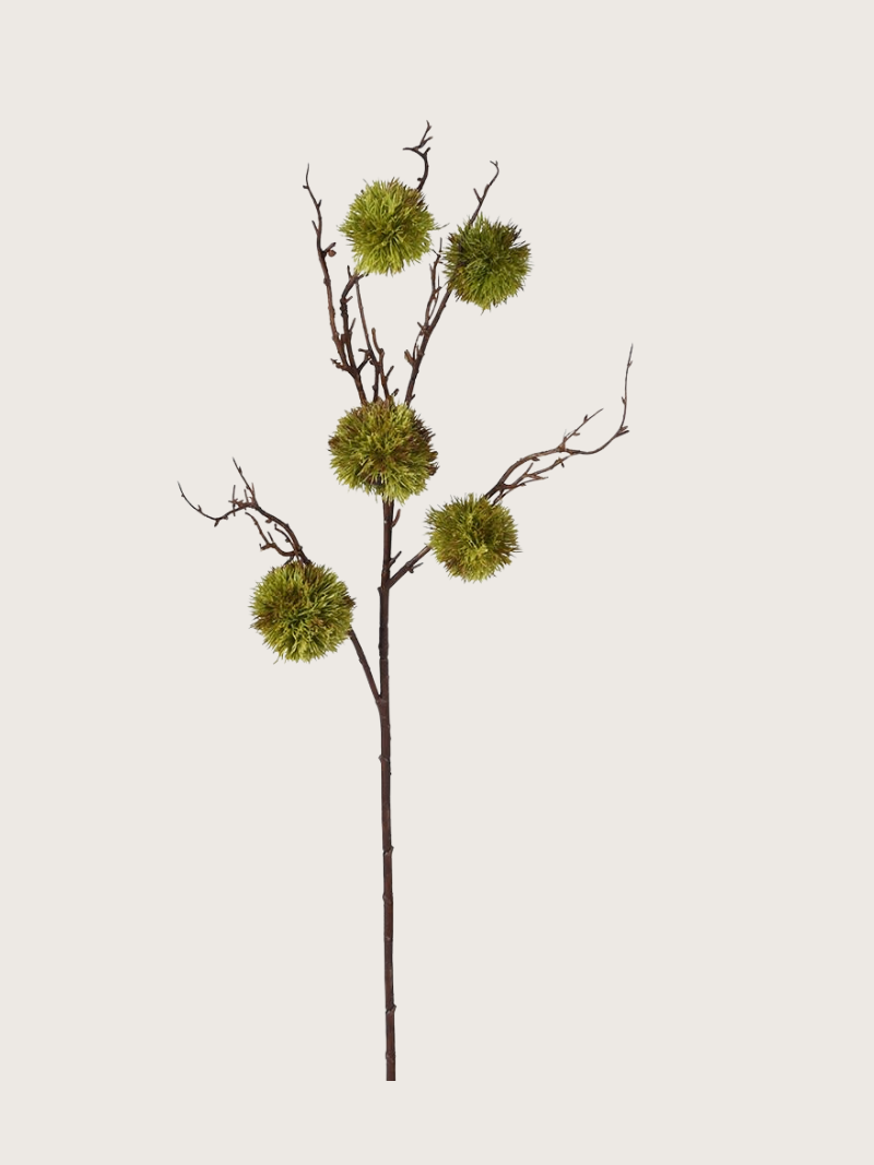 Artificial moss chestnut branch with green foliage on a white background