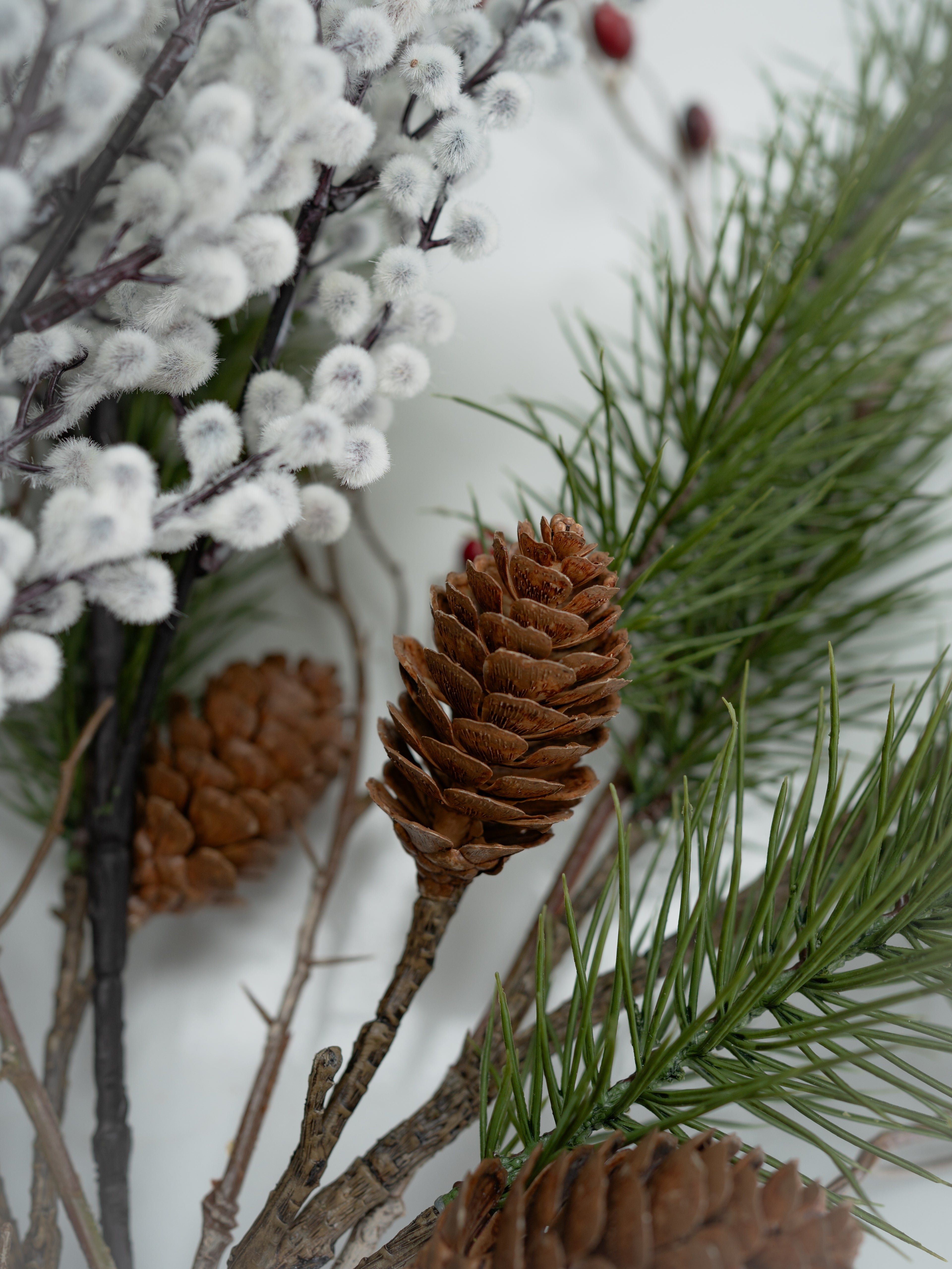 Faux Pine, Snowy Berry and Rosehip Branches Floral Arrangement