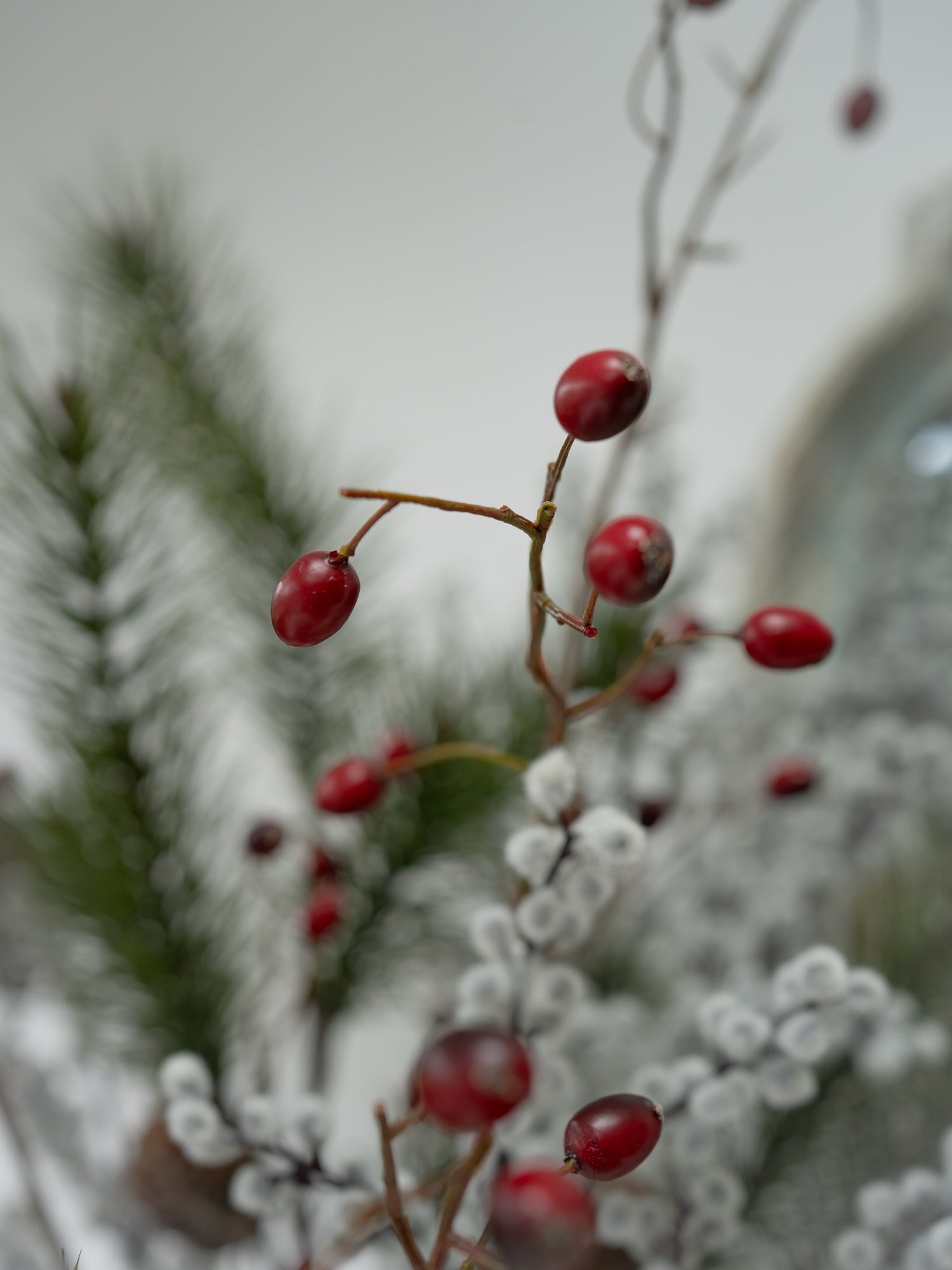 Faux Pine, Snowy Berry and Rosehip Branches Floral Arrangement