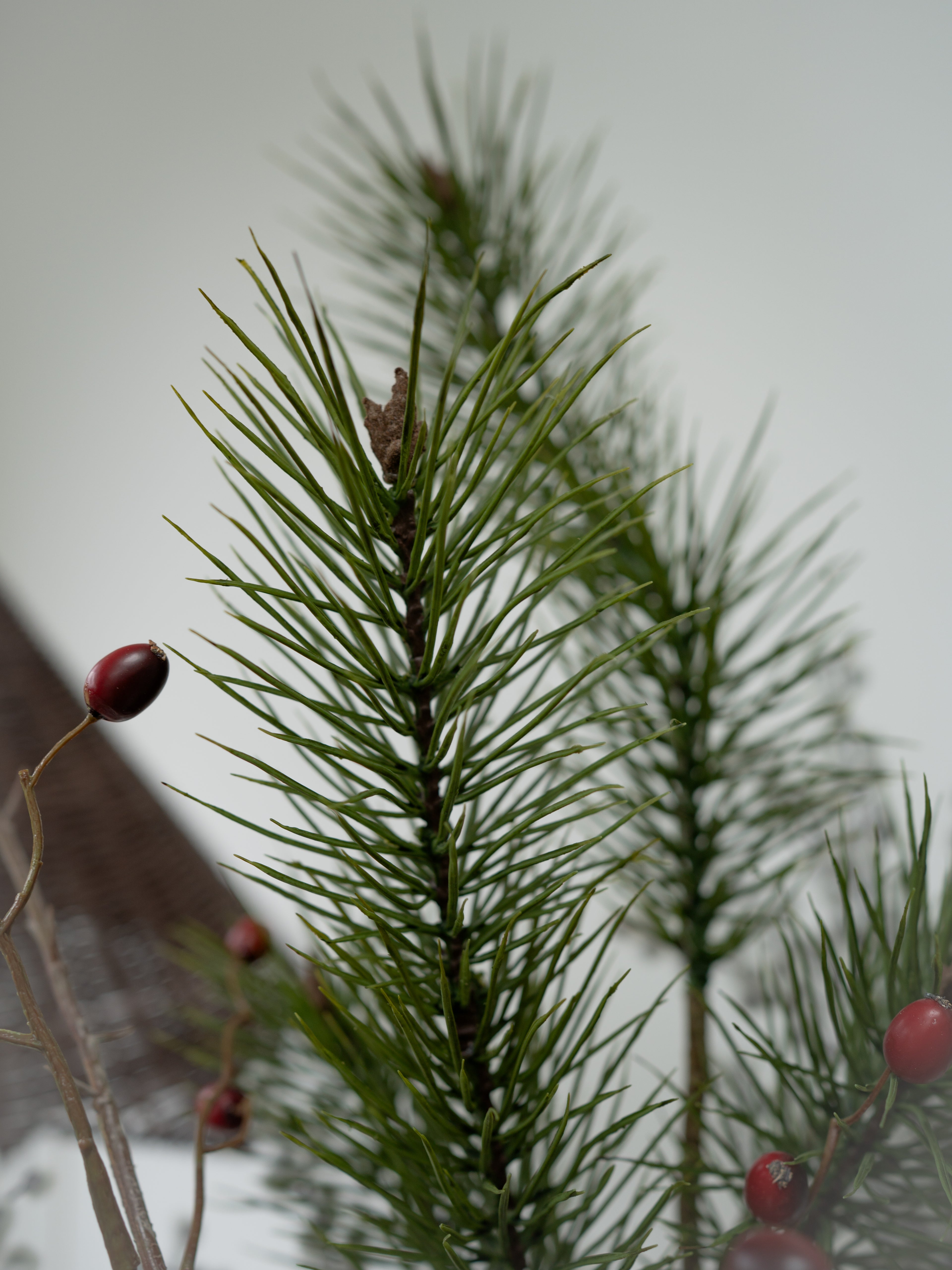 Faux Pine, Snowy Berry and Rosehip Branches Floral Arrangement