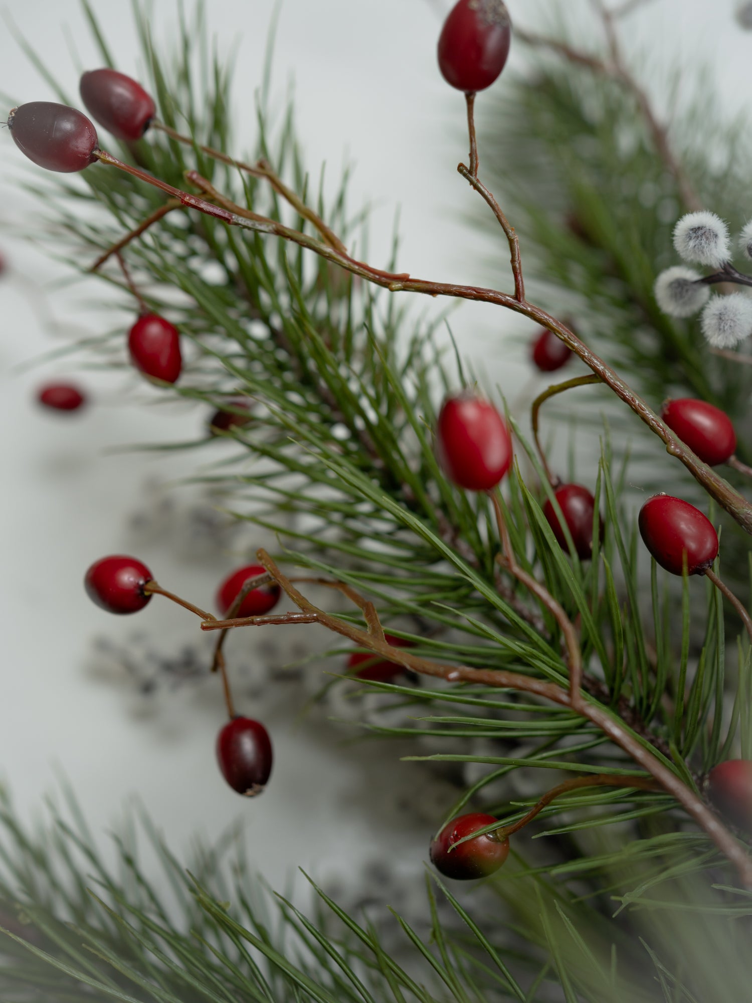 Faux Pine, Snowy Berry and Rosehip Branches Floral Arrangement