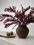 faux plum leaves in rustic brown vase, autumn inspired home styling