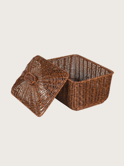 Wicker storage basket with a lid on a light beige background