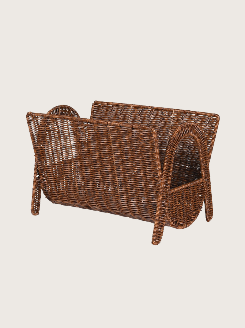 Wicker magazine rack on a beige background