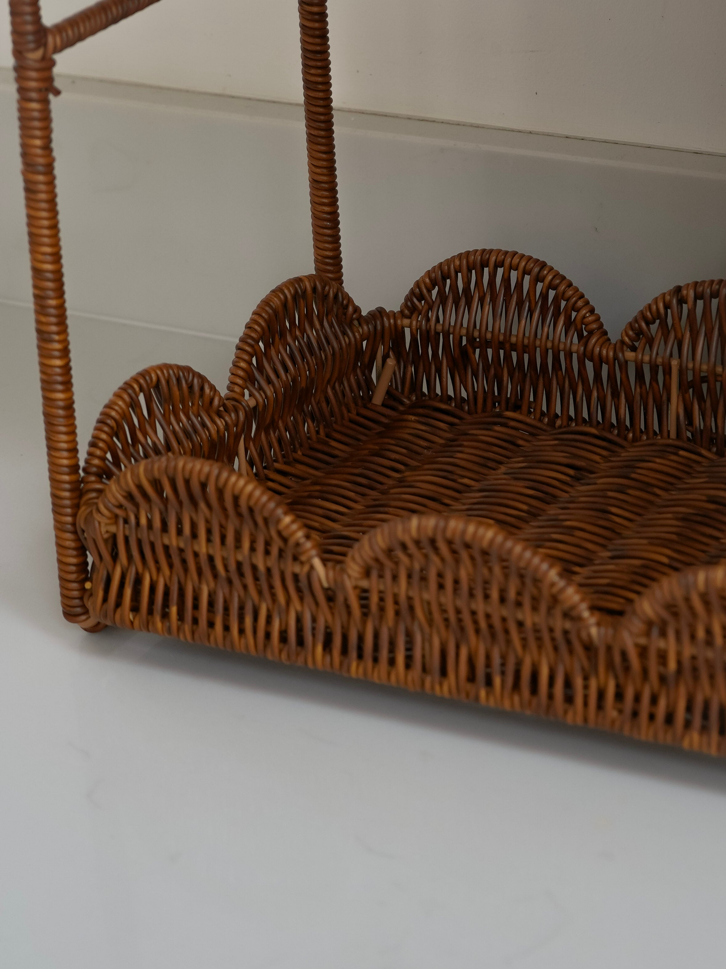 Wicker kitchen rack on a plain background