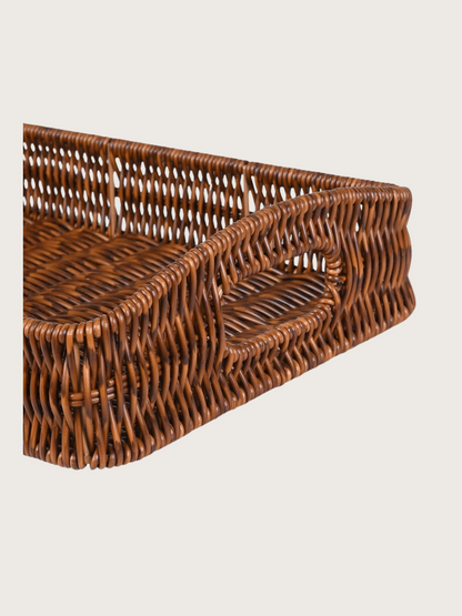 Woven brown basket on a light beige background