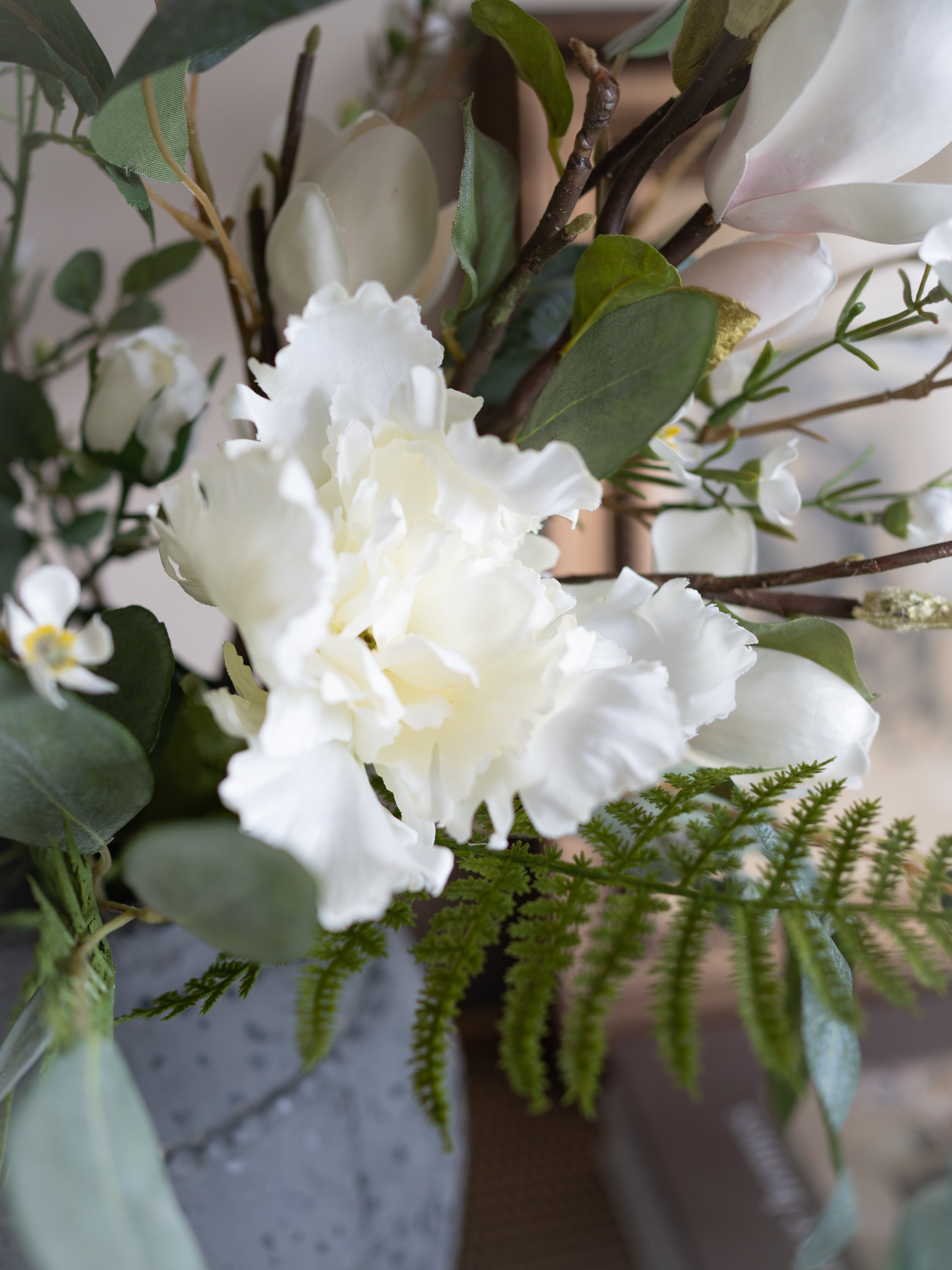 Close-up of a bouquet with white flowers and greenery
