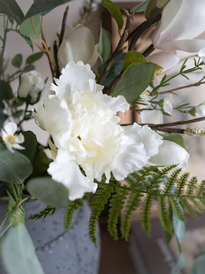 Close-up of a bouquet with white flowers and greenery