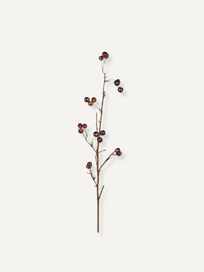 Artificial cherry branch on a white background