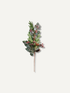 A single artificial winter branch with green pine needles, dark holly leaves, and small red berries on a thin brown stem, centered on a plain light warm-gray background.
