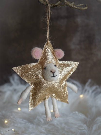 Decorative star-shaped ornament with a small animal face on a textured background