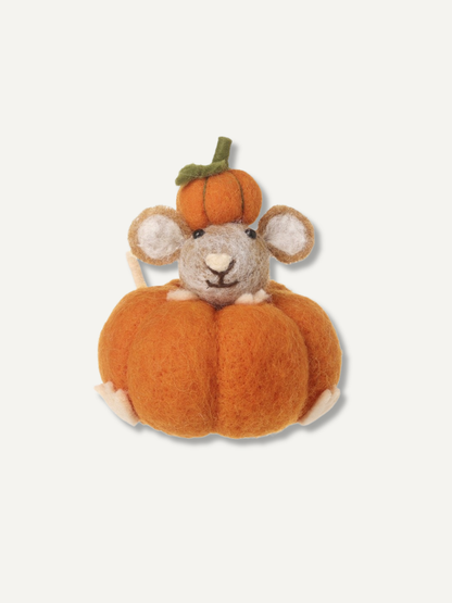 A felted wool plush toy of a gray mouse sitting inside a small orange pumpkin, with a larger orange pumpkin behind it, on a light off-white background.