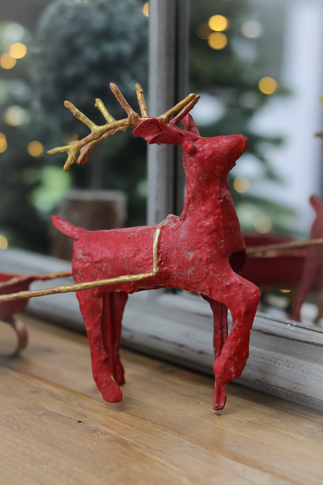 Red reindeer and sleigh