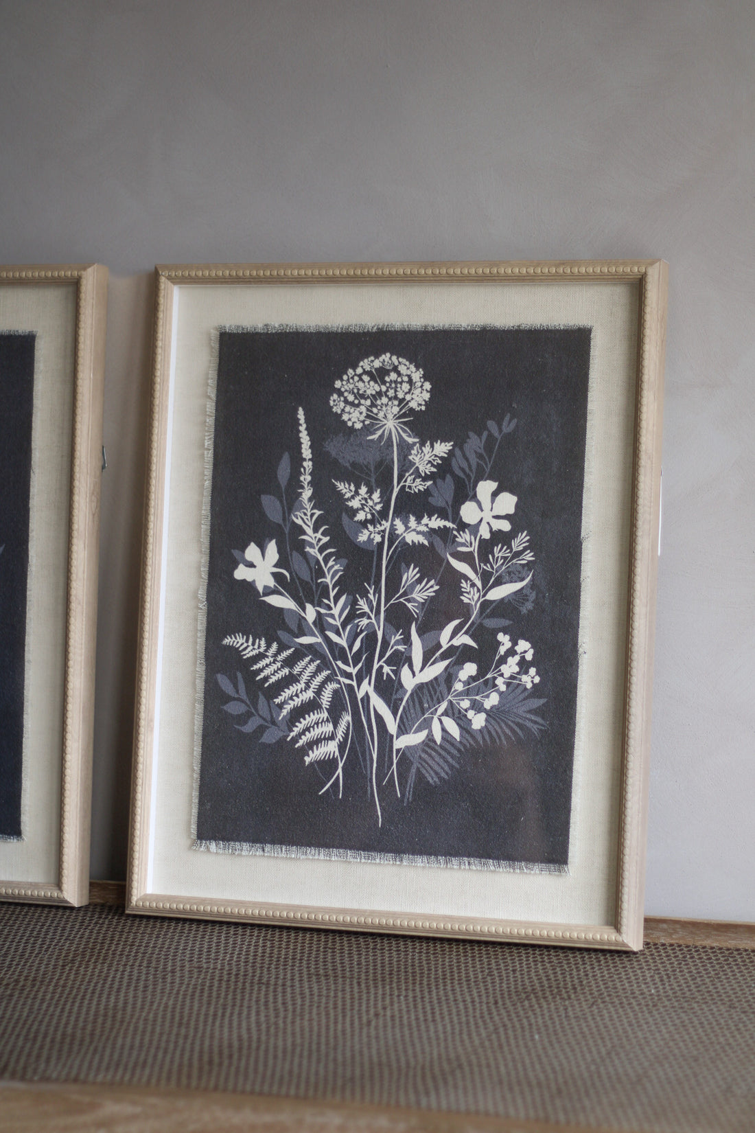 Framed botanical print on a gray wall