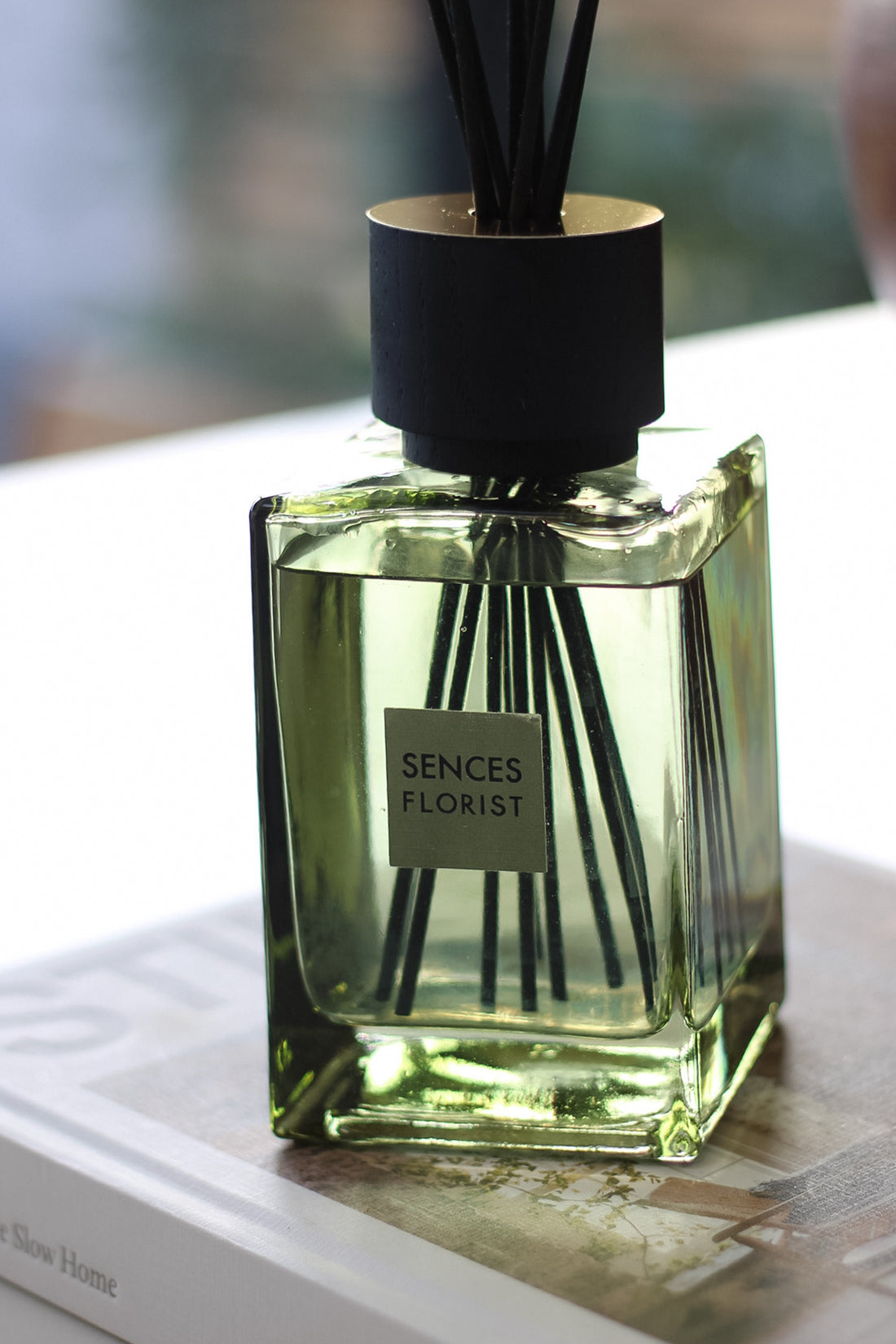 Sences Florist diffuser bottle with sticks on a surface