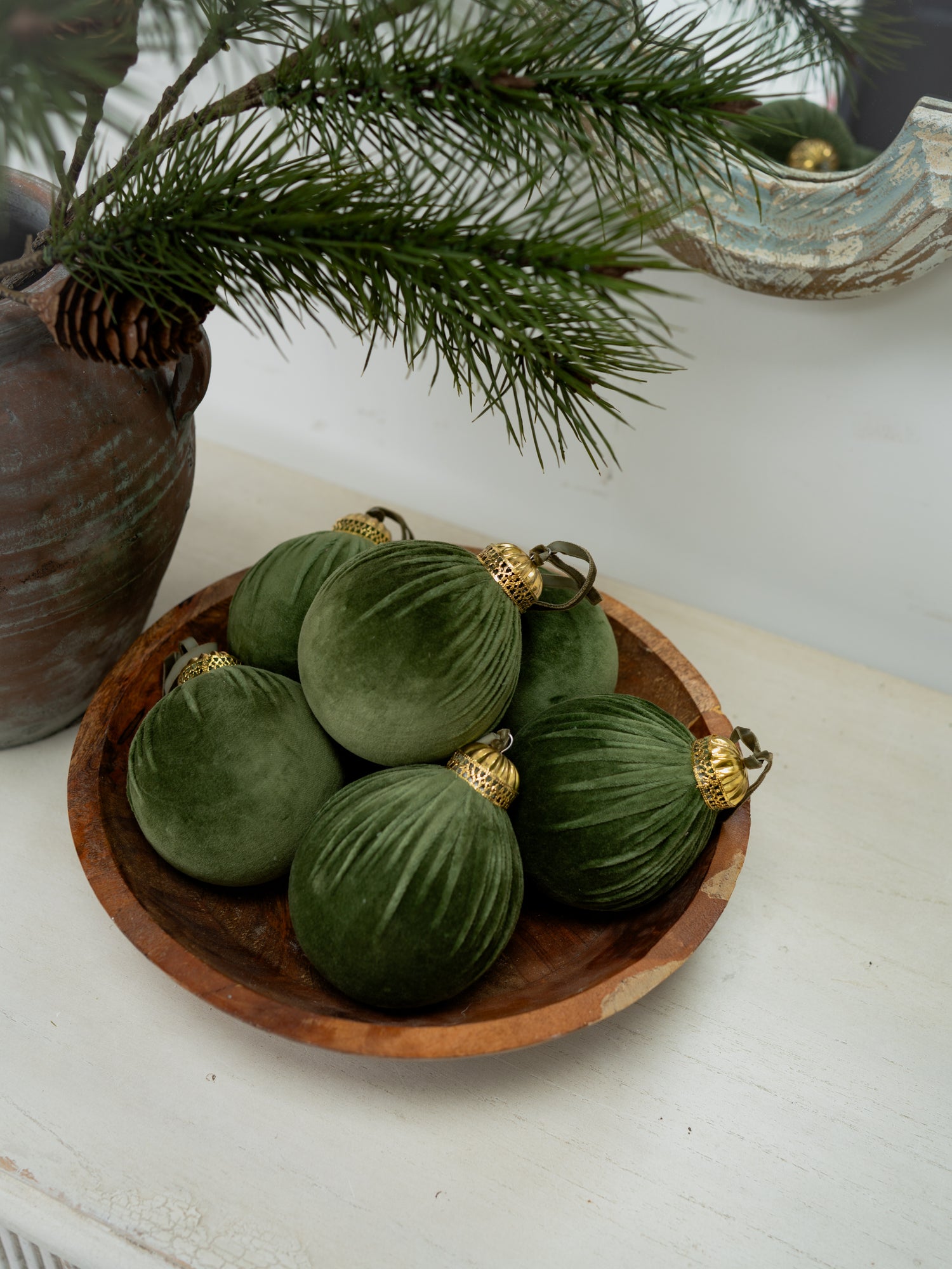 Forest Green Velvet Christmas Tree Bauble in wooden bowl, styling idea for christmas decorations
