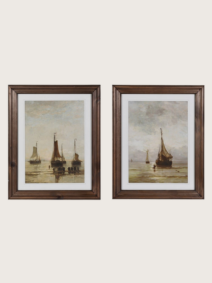 Two framed paintings of boats on a beige background