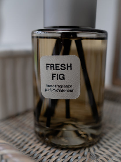 Clear glass diffuser labeled &