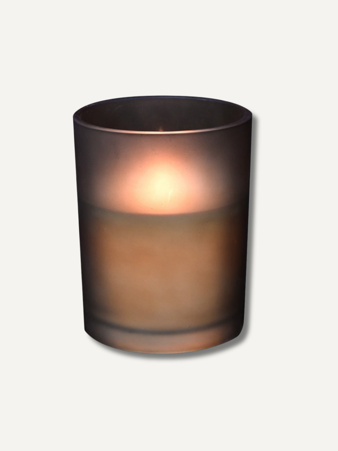 LED candle in a dark glass holder on a light gray background
