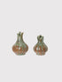 Two ceramic vases with a textured surface on a light gray background