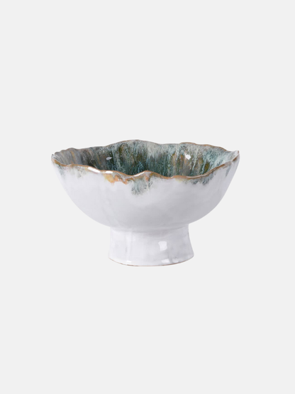Decorative ceramic bowl with textured surface on a white background