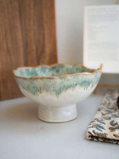 Green ombre ceramic bowl with textured green rim on a white surface for kitchen styling and decor