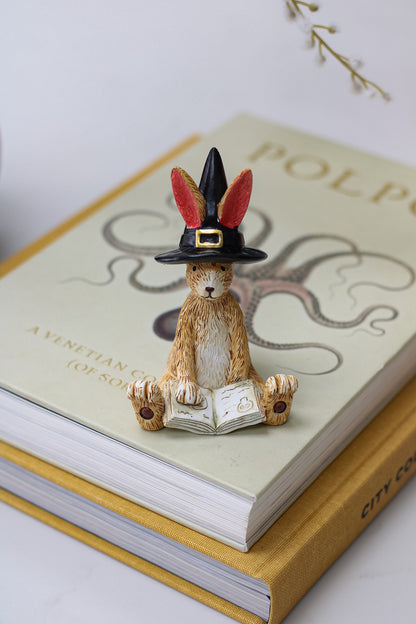 adorable autumn rabbit ornament with wizard hat and reading spells book