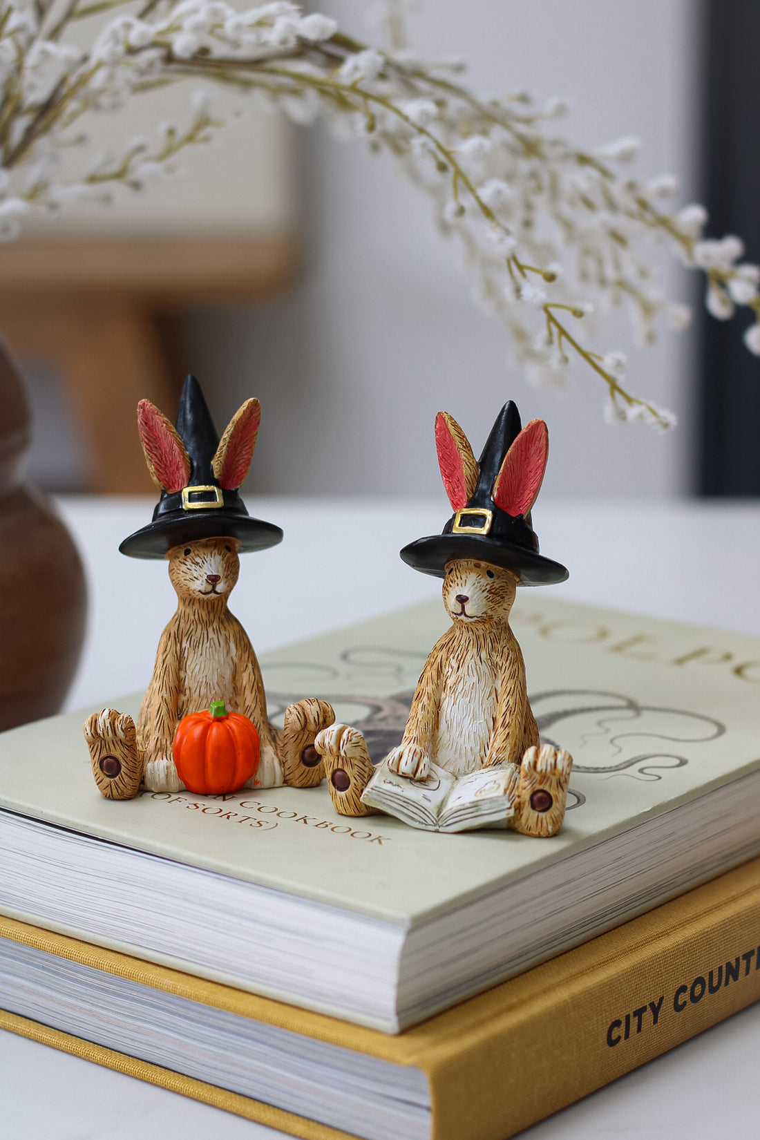 polyresin cute autumn rabbit decorations with wizards hats one is reading a book and one has a pumpkin