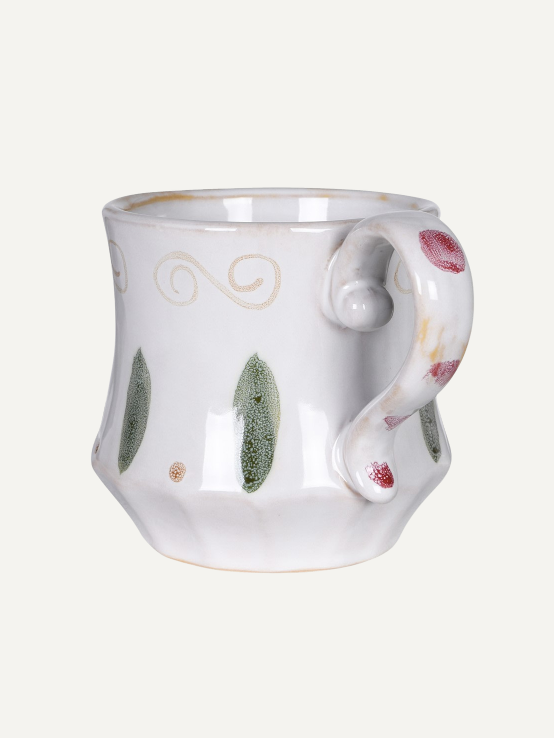 White ceramic mug with decorative handle and patterns on a white background