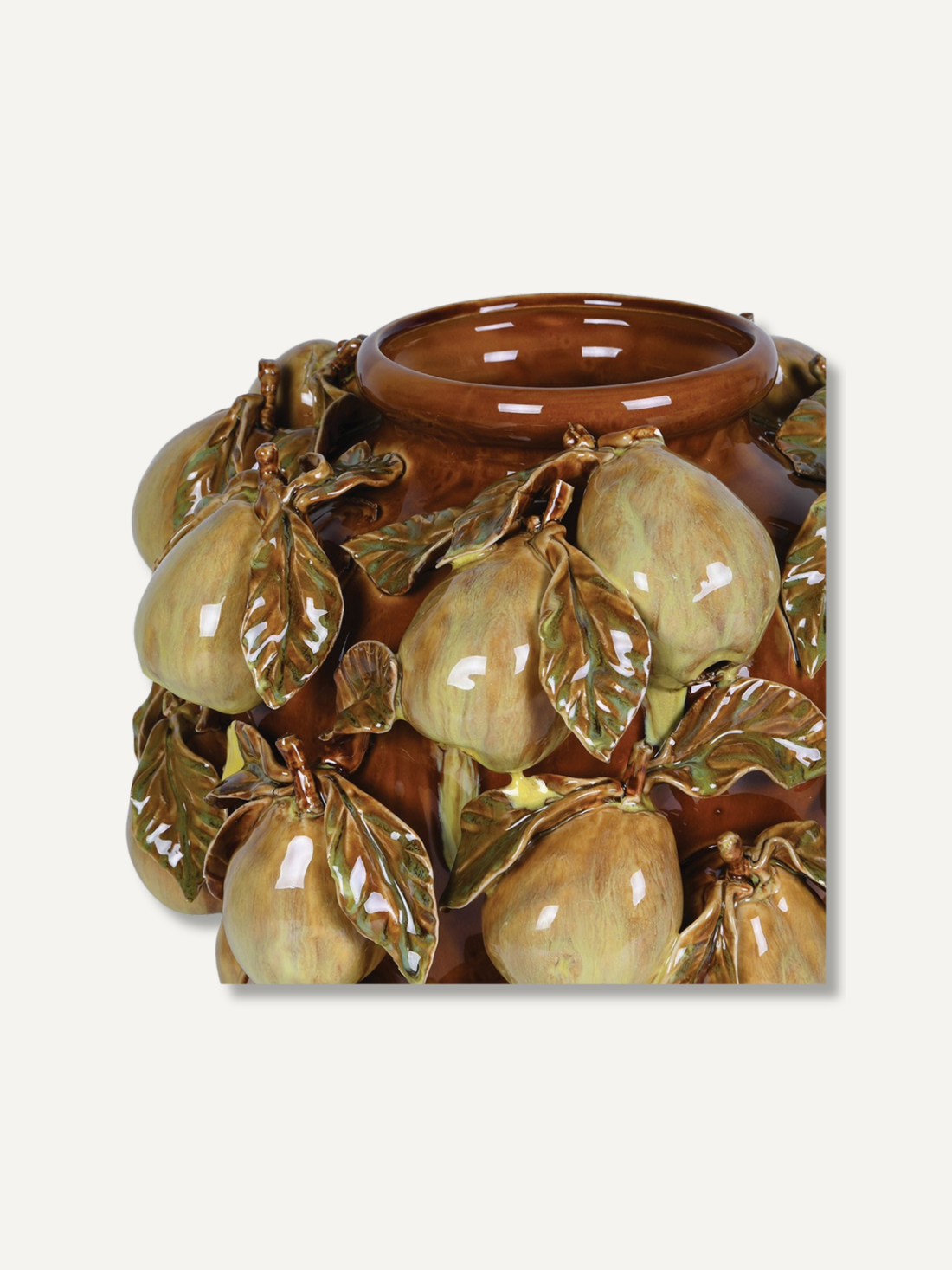 A glazed ceramic fruit vase featuring sculpted pears and leaves in earthy brown and olive-green tones, shown against a plain light background.