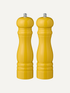 Two harvest yellow salt and pepper wooden mills on a white background, kitchen styling ideas for a pop of funky colour