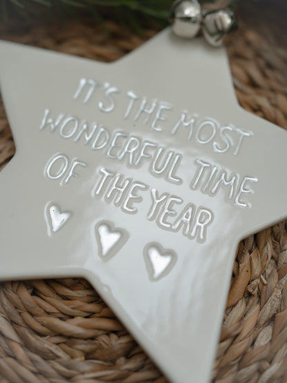 White ceramic star ornament with &