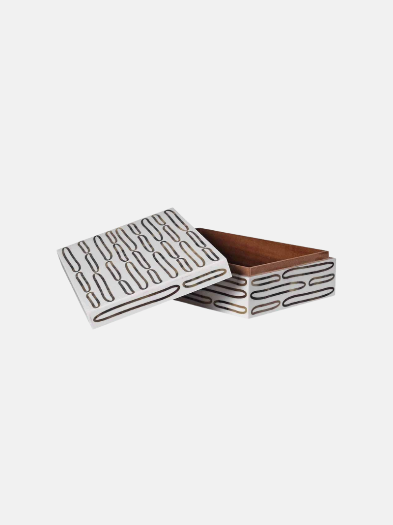 Wooden box with geometric pattern on a white background