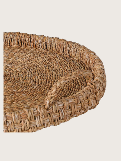 Close-up of a woven basket with a beige background