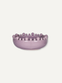A lavender purple ceramic bowl featuring a raised border of small, evenly spaced decorative beads, shown against a solid off-white background.