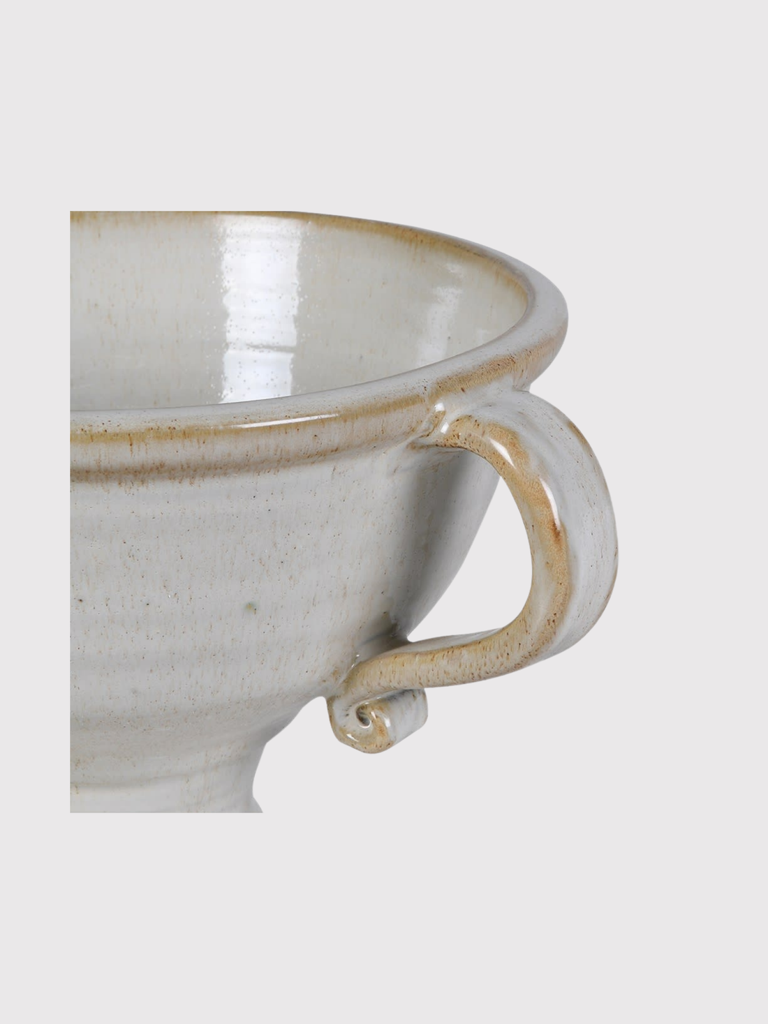 White ceramic urn vase with brown rim and handle on a light gray background