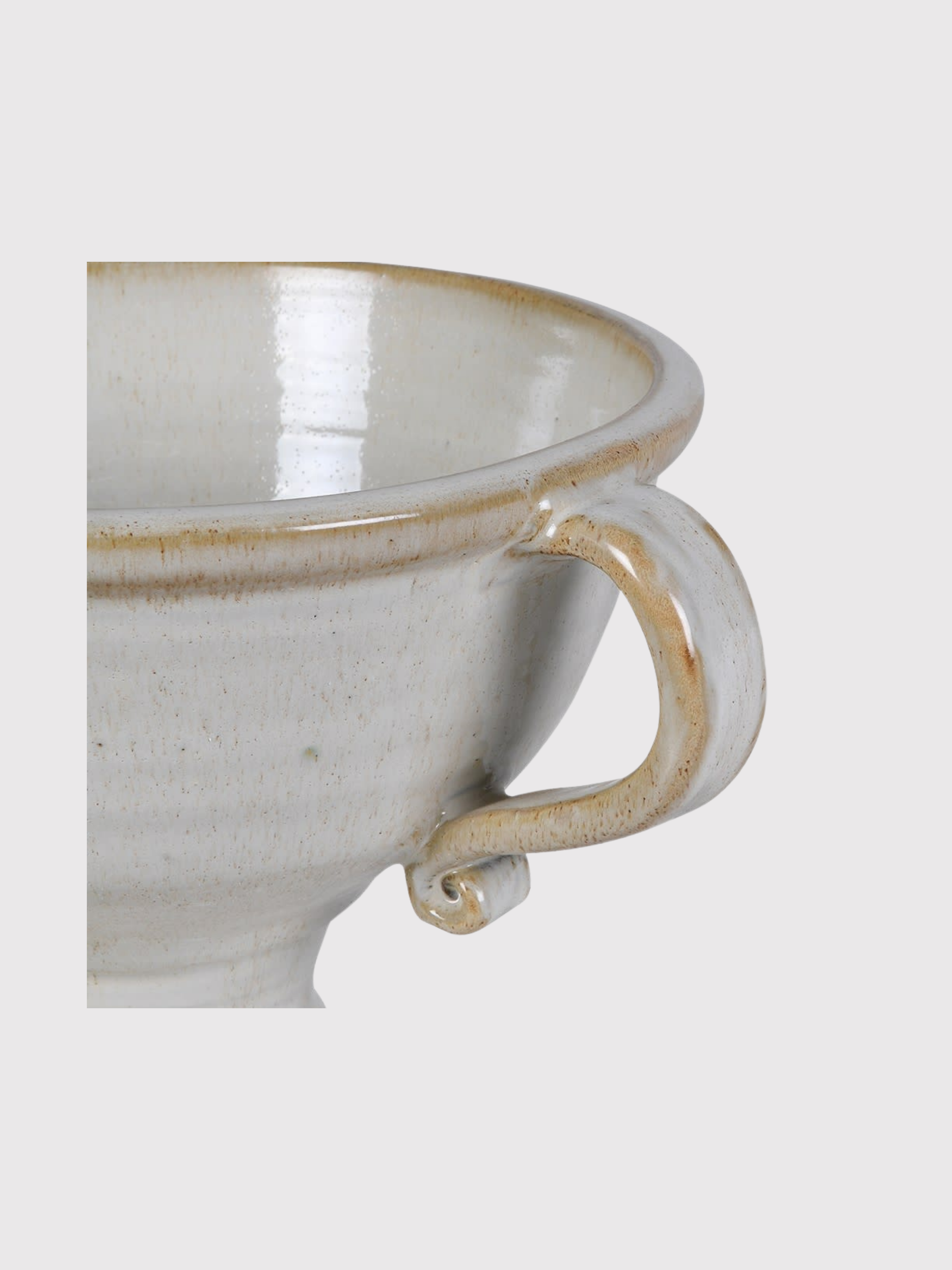 White ceramic urn vase with brown rim and handle on a light gray background