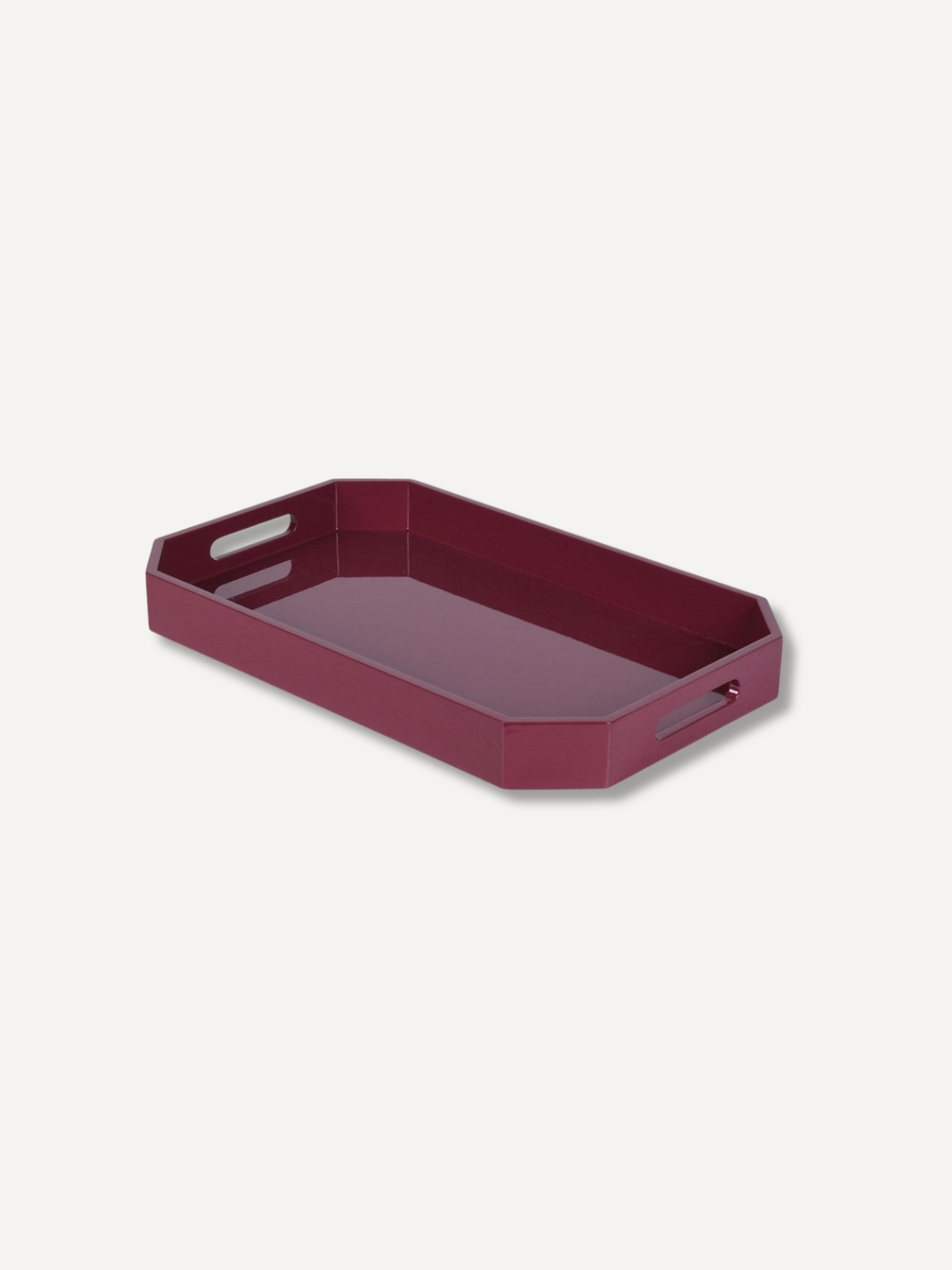A burgundy rectangular serving tray with integrated handles, shown at an angle on a light off-white background.