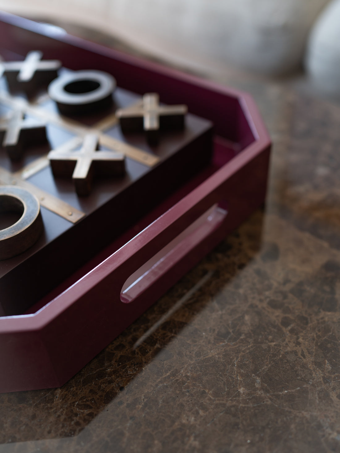 A close-up of a wooden game board with wooden &
