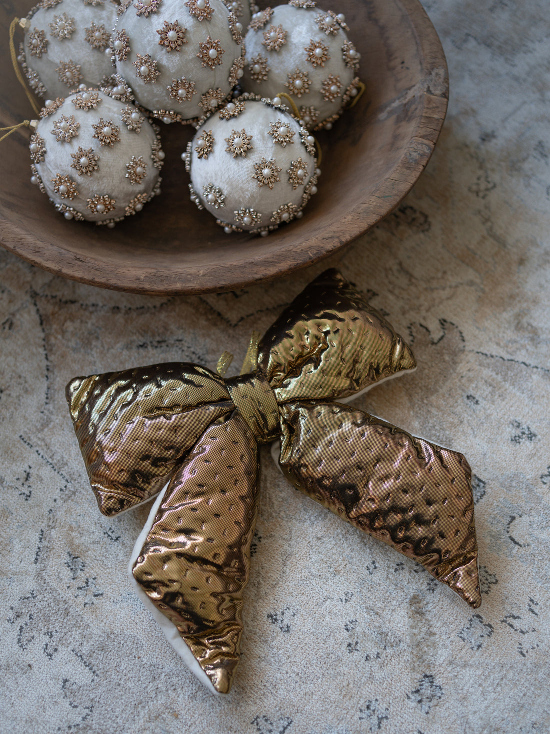 Metallic Gold Christmas Bow Decoration with wooden bowl filled with ivory pearl velvet baubles