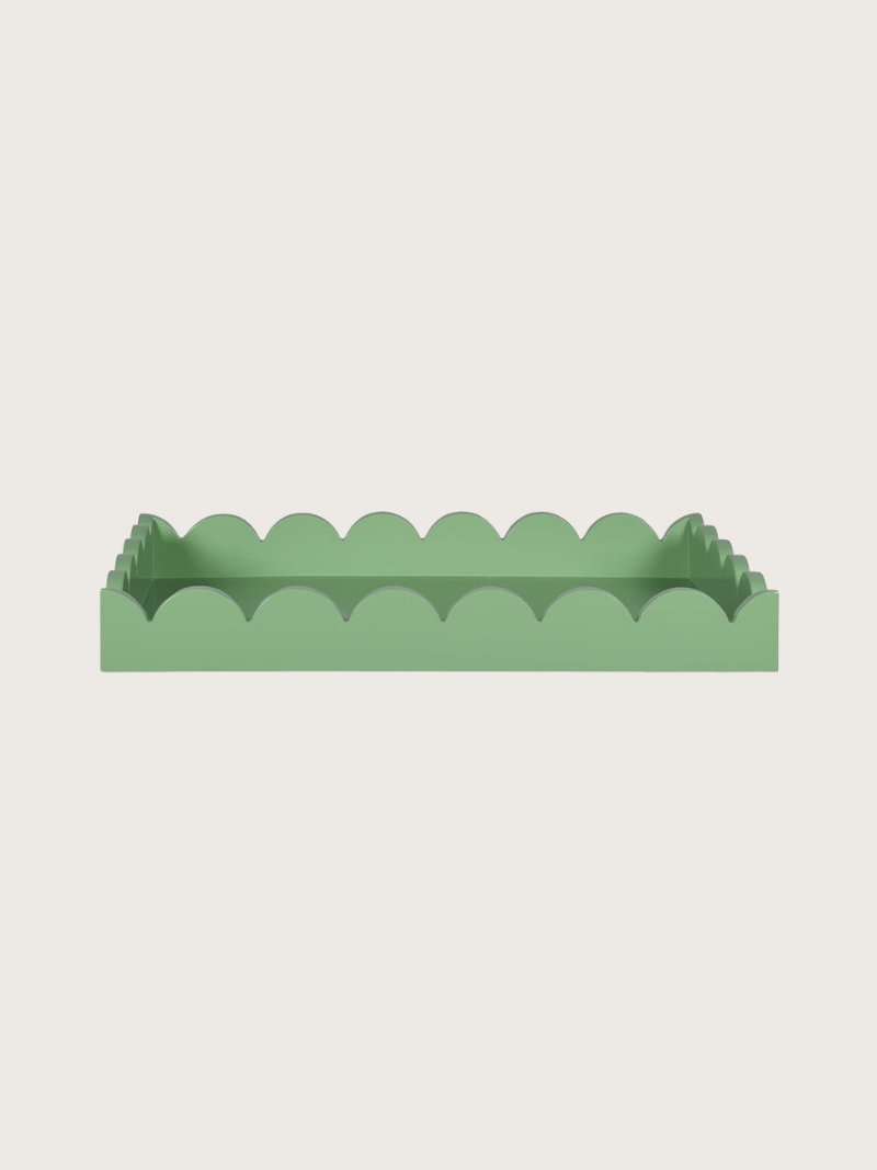 Green scalloped-edge tray on a light gray background