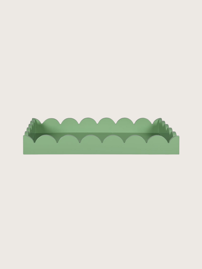 Green scalloped-edge tray on a light gray background