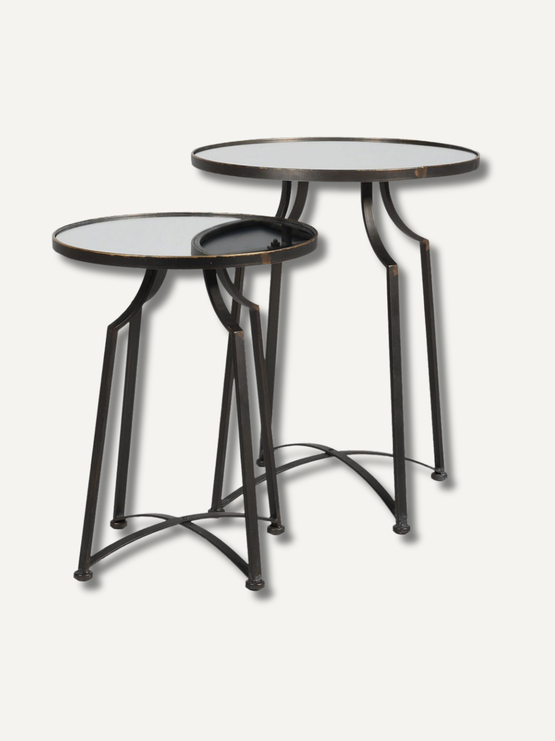 Two round metal side tables with glass tops on a white background