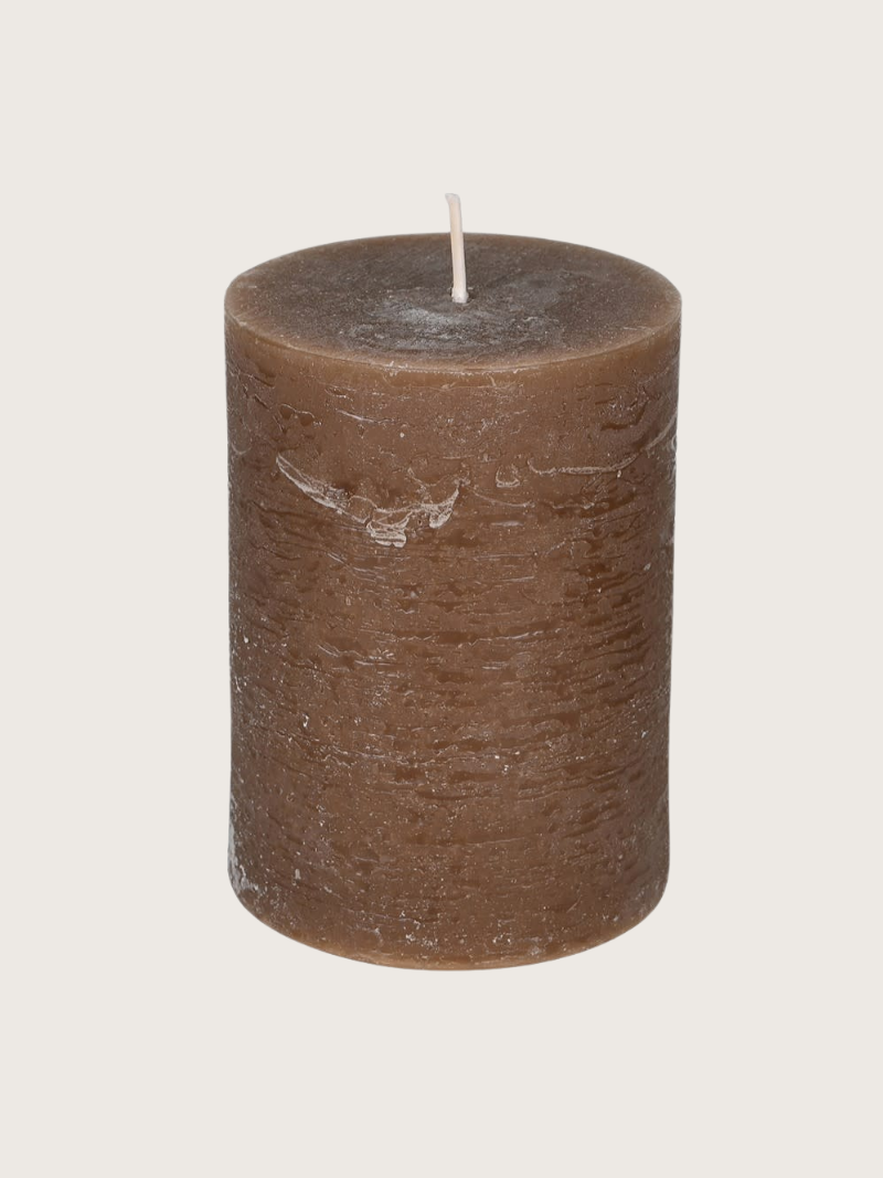 Brown candle on a light gray background
